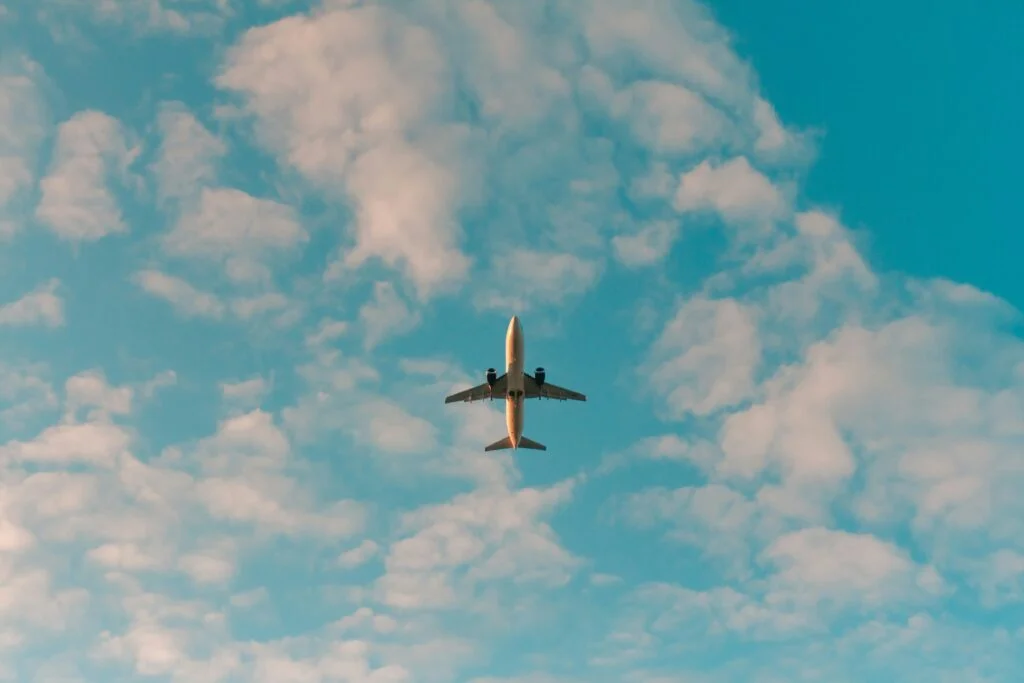 Photo of an airplane - Skincare in the Sky: 4 Steps to Avoid Breakouts When Flying